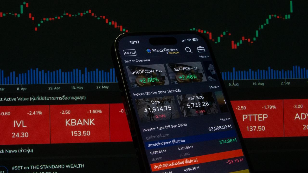 about-01 Close-up of a digital stock trading app interface with investment charts and market trends displayed.