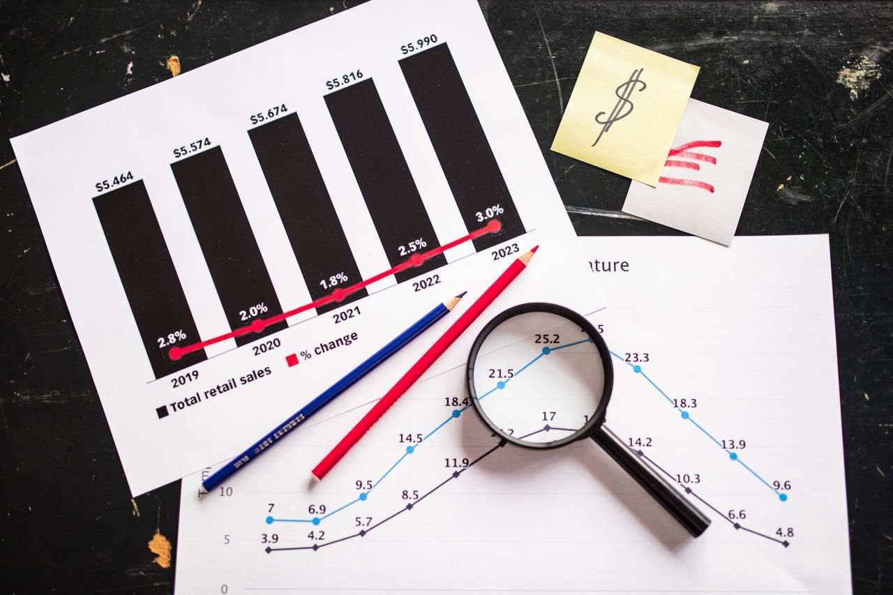 our-services-1 Charts and graphs highlighting retail sales growth, utilizing a magnifying glass for detail.